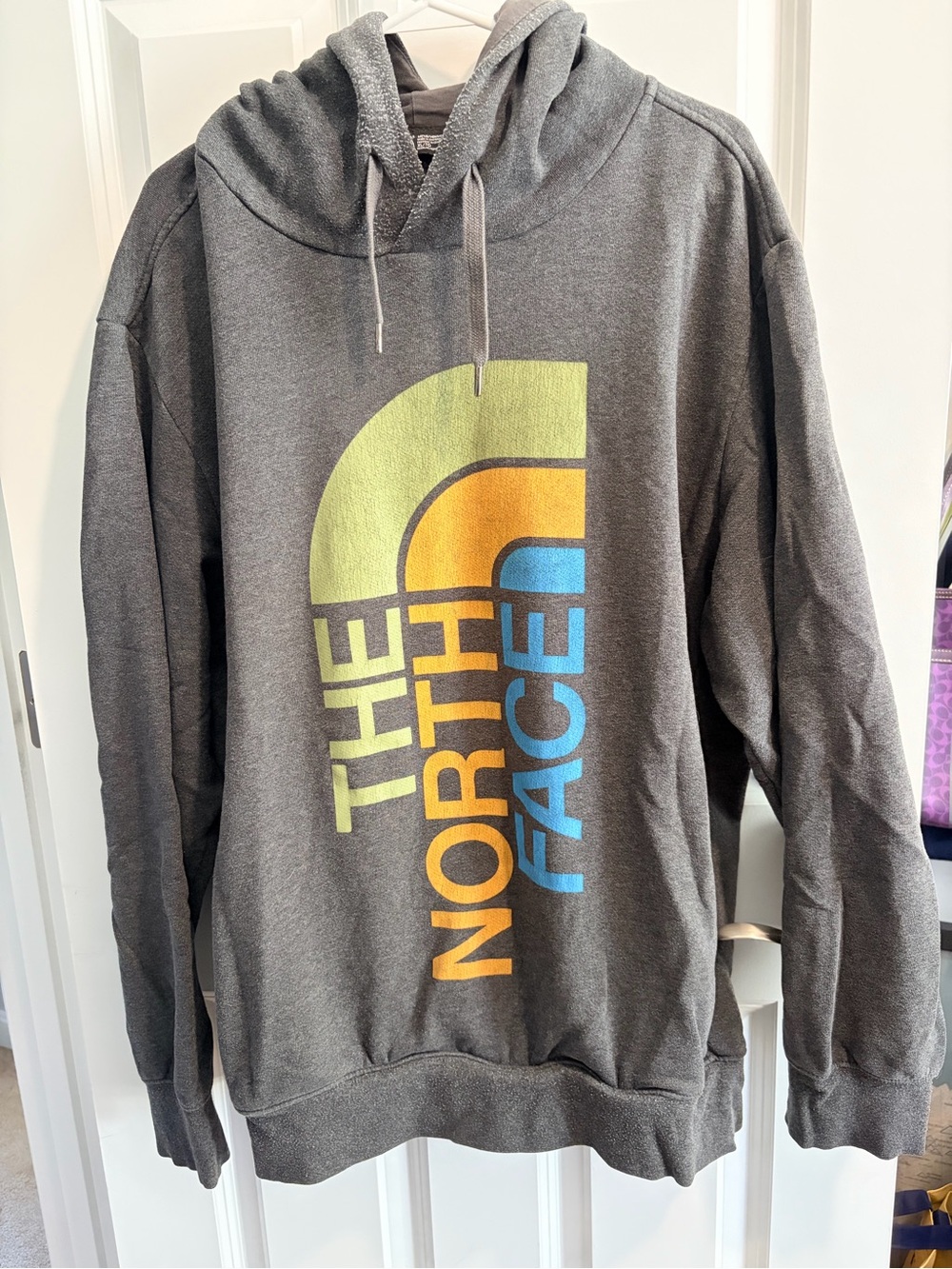 The North Face Gray Hoodie with Yellow Orange and Blue Logo